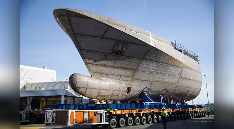 One half of the future HMAS Arafura is transports to meet its aft half.