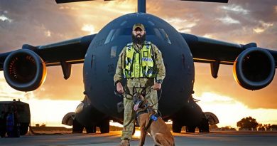 Military working-dog handler Corporal Brodie McIntyre with his dog Kesha provides security to an Air Force C-17A Globemaster at RAAF Base Darwin. Photo by Sergeant Ben Dempster.