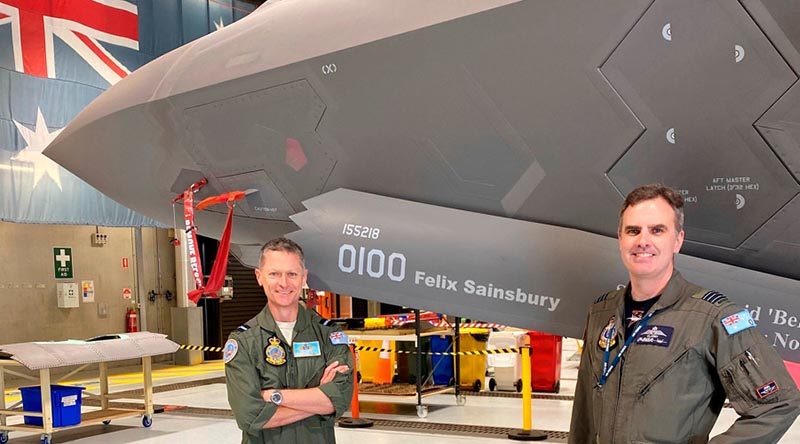 Commander Air Combat Group Air Commodore Tim Alsop and Commanding Officer No. 3 Squadron Wing Commander Darren Clare show off the front of Joint Strike Fighter A35-010, temporarily rebranded in celebration of Felix Sainsbury's 100th birthday.