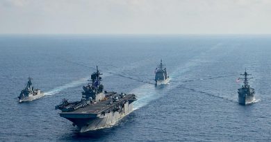 Royal Australian Navy frigate HMAS Parramatta (left) conducts officer-of-the-watch manoeuvres with amphibious assault ship USS America, guided-missile cruiser USS Bunker Hill and guided-missile destroyer USS Barry in the South China Sea. Photo by USS America crew member.