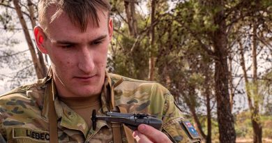 Lance Corporal Ash-Leigh Liebeck, 7RAR, inspects a Black Hornet nano UAV. Photo by Private Luke Jones.