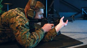 US Marine Corps Corporal Isaiah Fraser, with Marine Rotational Force – Darwin, shoots an M4 carbine at Robertson Barracks, Darwin after the Marine service rifle was integrated with the Australian's Weapons Training Simulation System for the first time. US Marine Corps photo by Lance Corporal Natalie Greenwood.