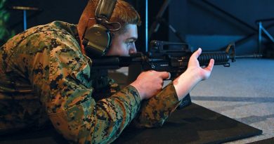 US Marine Corps Corporal Isaiah Fraser, with Marine Rotational Force – Darwin, shoots an M4 carbine at Robertson Barracks, Darwin after the Marine service rifle was integrated with the Australian's Weapons Training Simulation System for the first time. US Marine Corps photo by Lance Corporal Natalie Greenwood.