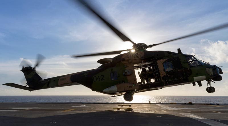 An MRH-90 maritime support helicopter on HMAS Canberra. Photo by Leading Seaman Jake Badior.