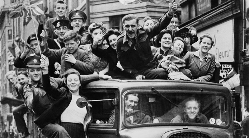 Ve Day Celebrations in London, 8 May 1945 A truck of revellers passing through the Strand, London. Imperial War Museum collection.