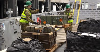 Australian Army Cargo Specialists and Thales personnel move pallets of ammunition from an HMAS Adelaide landing craft to the wharf at Eden, NSW. Photo by Able Seaman Jarrod Mulvihill.