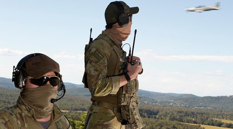 Combat Controllers from No. 4 Squadron based at RAAF Base Williamtown communicate coordinates for an incoming aircraft during Exercise Havoc Strike. Photo by Sergeant Brett Sherriff.