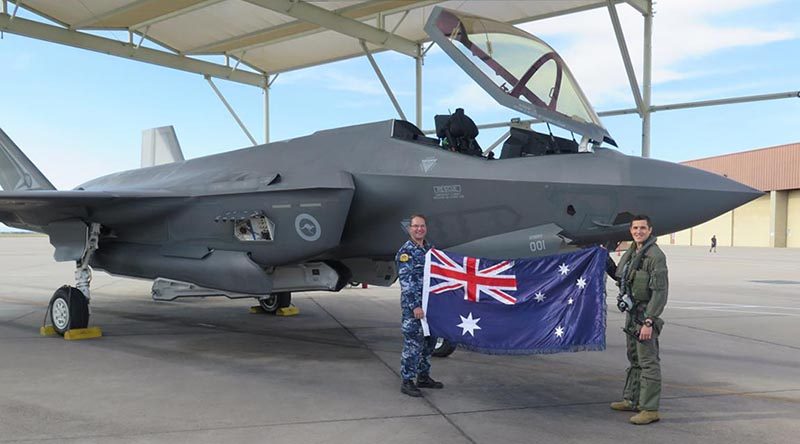 Squadron Leader Chris Myles, left, the Australian Participant Maintenance Lead at Luke Air Force Base in Arizona, and pilot Flight Lieutenant Adrian Herenda, with the F-35A A35-001 after the aircraft reached 1000 flying hours. Story by Alisha Welch.