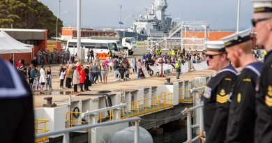 Friends and family of HMAS Toowoomba's ship's company line the wharf as the ship berth's alongside Parkes Wharf, HMAS Stirling, Western Australia. Photo by Able Seaman Lincoln Commane.