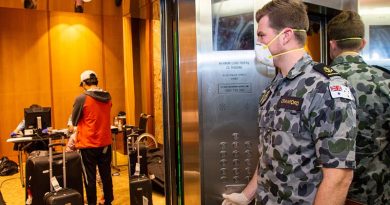Leading Seaman Michael Crawford waits in a lift of a Sydney hotel to assist travellers going into mandatory 14-day quarantine. Around 850 of 1000 ADF member being deployed to Victoria will be assigned to similar duties in Melbourne. Photo by Petty Officer Justin Brown.