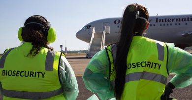 The first plane-load of Marine Rotational Force-Darwin marines are greeted by biosecurity officers at RAAF Base Darwin. The marines were tested for COVID-19 and placed in a 14-day quarantine facility. US Marine Corps photo by Lance Corporal Natalie Greenwood.