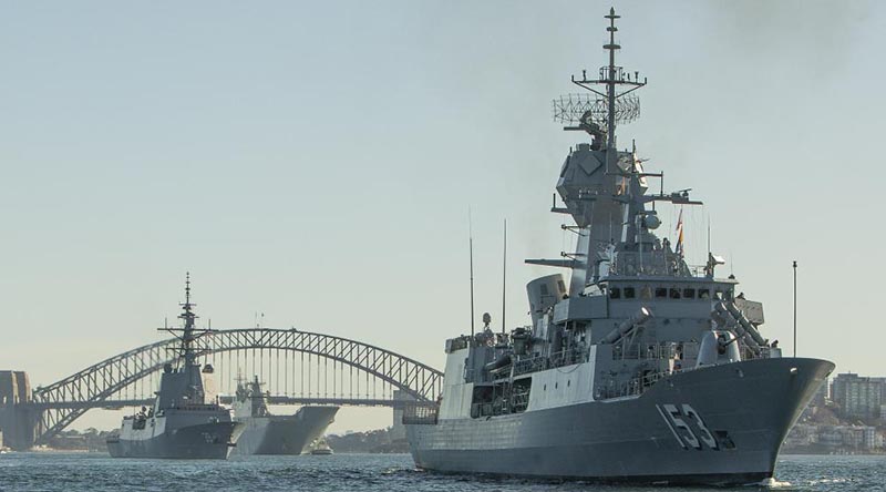 HMAS Stuart leads HMA Ships Hobart and Canberra out of Sydney Harbour as seven Aussie warships depart head to sea. Photo by Able Seaman Benjamin Ricketts.