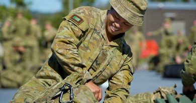 Corporal Mario Larga from the 8th/9th Battalion, Royal Australian Regiment, prepares his gear at Gallipoli Barracks, Brisbane, before deploying on Operation COVID-19 Assist. Photo by Corporal Nicole Dorrett.