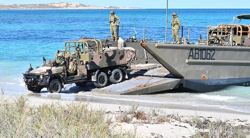 The first RSFG vehicle comes ashore at Norwegian Bay. Australian Border Force photo.