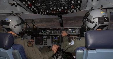 No. 36 Squadron pilots Flight Lieutenants Tim Smith, left, and Matthew Bruton fly a mission in the C-17A Globemaster III simulator during Exercise Virtual Pitch Black at RAAF Base Amberley. Photo by Sergeant Peter Borys.