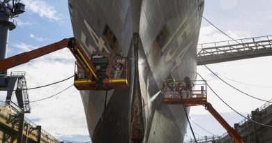 Defence contractors conduct maintenance on HMAS Parramatta during her refit in the Captain Cook Graving Dock at Garden Island, Sydney. Photo by Leading Seaman Leo Baumgartner.