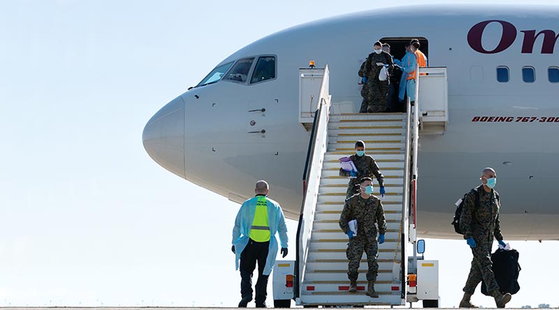US Marines of Marine Rotational Force - Darwin arrive at RAAF Base Darwin, NT, greeted by health-screening officials. Photo by Petty Officer Peter Thompson.