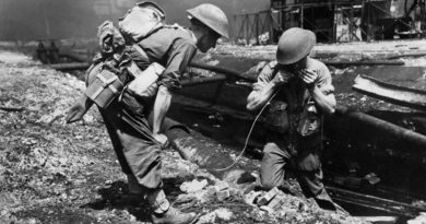 Sappers of the 2/4th Field Company prepare to blow up pipe lines obstructing the movement of tanks supporting the advance through the oil refinery area at Balikpapan. AWM 128776