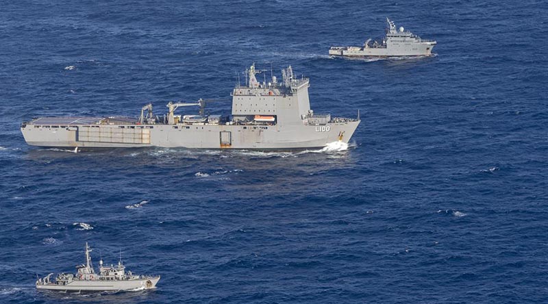 HMAS Choules, centre, and HMAS Huon, bottom, rendezvous with French Navy Ship d’Entrecasteaux during the Australian ships' transit to Vanuatu. Photo by Leading Seaman James McDougall.