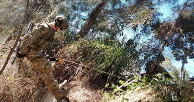 A soldier from 2CER abseils to a casualty in a confined space during personnel rescue training in Brisbane.