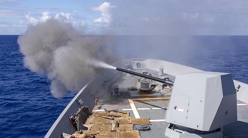 HMAS Hobart fires its 5-inch gun during Exercise RIMPAC 20. Photo by Leading Seaman Ernesto Sanchez.