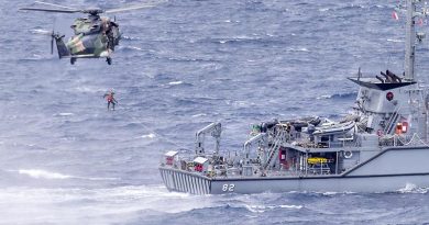 HMAS Choules' embarked MRH-90 Taipan helicopter conducts passenger transfer serials with HMAS Huon during the ships' transit to Vanuatu. Photo by Leading Seaman James McDougall.