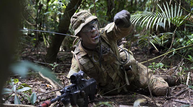 Lieutenant Patrick Omodei, of 3rd Battalion, Royal Australian Regiment, calls out enemy target indications during the Infantry Regimental Officers Basic Course. Photo by Corporal Brodie Cross.