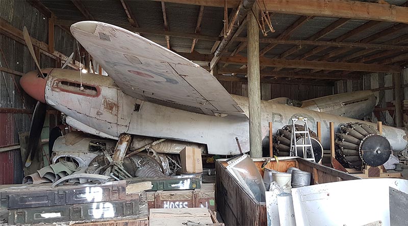 A de Havilland Mosquito and tonnes of aircraft parts and memorabilia in the 'Aladin's Cave' shed of recluse Kiwi collector John Smith. Photo by Graham Orphan.