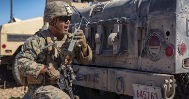 US Marine Corps Sergeant Jacob Montana with Combined Anti-Armor Team, Ground Combat Element, Marine Rotational Force – Darwin, relays commands to his Marines during a simulated fire mission at Mount Bundey Training Area, NT. US Marine Corps photo by Corporal Lydia Gordon.