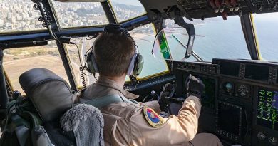 A Royal Australian Air Force pilot look over Beirut from the flight deck of his C-130J Hercules loaded with Australian aid relief supplies for the people of Lebanon. Photo by Corporal Tristan Kennedy.