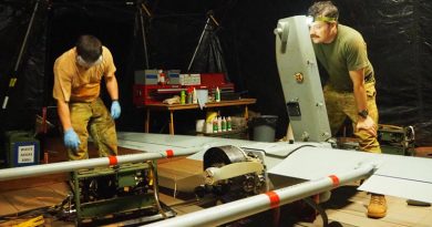 Craftsman Matt Williams, left, and Corporal Jonathon Healy service a Shadow air vehicle at Bamaga, Far North Queensland, during Operation Resolute.