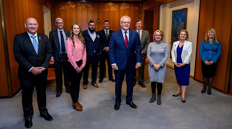 Prime Minister Scott Morrison (centre) with veterans and representatives of Soldier On and IBM. 