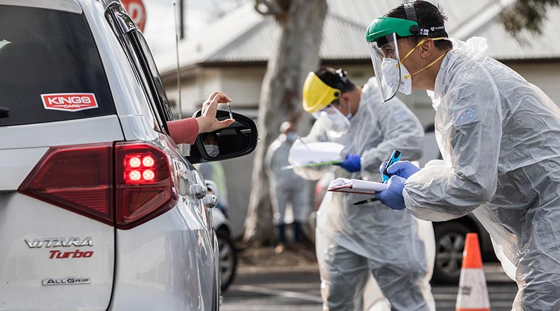 Australian Army soldiers confirm driver’s details at a COVID-19 testing site in Victoria in support of Op COVID-19 Assist. Photo by Leading Aircraftman John Solomon.