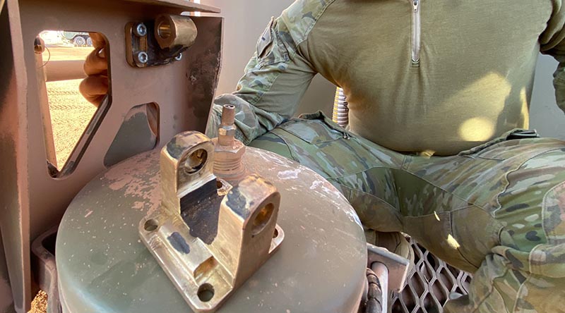 A 3D-printed metal mounting bracket for a bulk fuel support module printed out bush at Mount Bundy Training Area. Photo supplied.