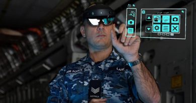 Sergeant Thomas Lane from No. 36 Squadron uses the HoloLens mixed-reality device during maintenance of a C-17A Globemaster III aircraft.