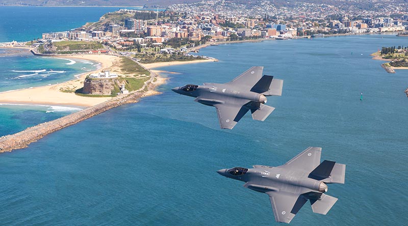 Outgoing Commanding Officer No. 3 Squadron Wing Commander Darren Clare and incoming Commanding Officer No. 3 Squadron Wing Commander Matthew Harper fly over Newcastle shortly before their change-of-command ceremony. Photo by Sergeant David Gibbs.