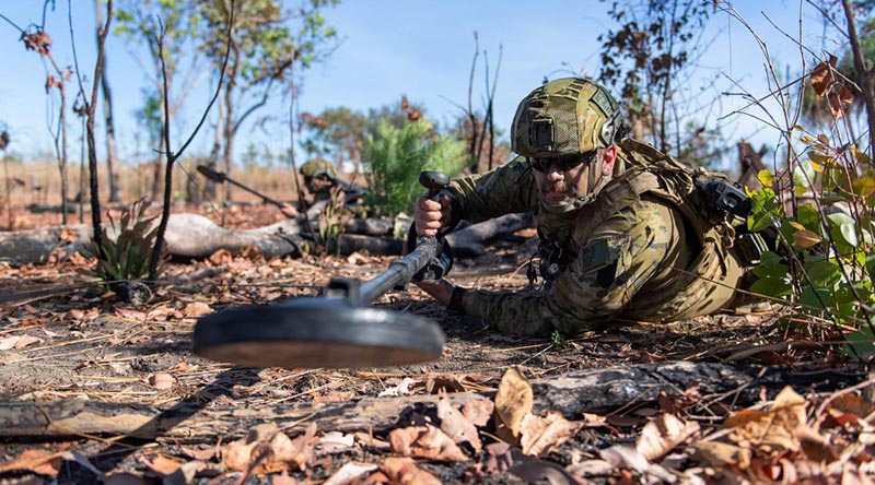 Sapper Lewis Coulter sweeps for mines during the 1st Combat Engineer Regiment Commanding Officers' Challenge held at Robertson Barracks, Northern Territory. Photo by Private Rodrigo Villablanca.