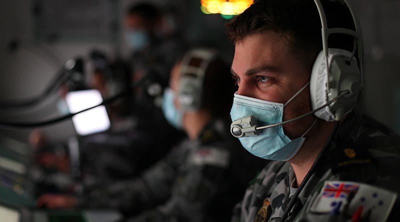 HMAS Anzac sailor Able Seaman Curtis Willmore monitors his console in the operations room of the frigate simulator at HMAS Stirling, Western Australia, during Exercise Viking Raider. Photo by Leading Seaman Ronnie Baltoft.