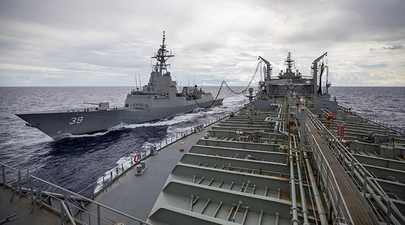 HMAS Sirius conducts her 700th replenishment at sea, with HMAS Hobart, during their Regional Presence Deployment. Photo by Leading Seaman Christopher Szumlanski.