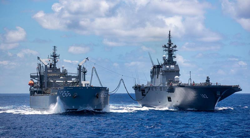 HMAS Sirius conducts a replenishment at sea with Japanese Ship Ise in the southern waters of Hawaii during Exercise RIMPAC. Photo by Leading Seaman Christopher Szumlanski. 