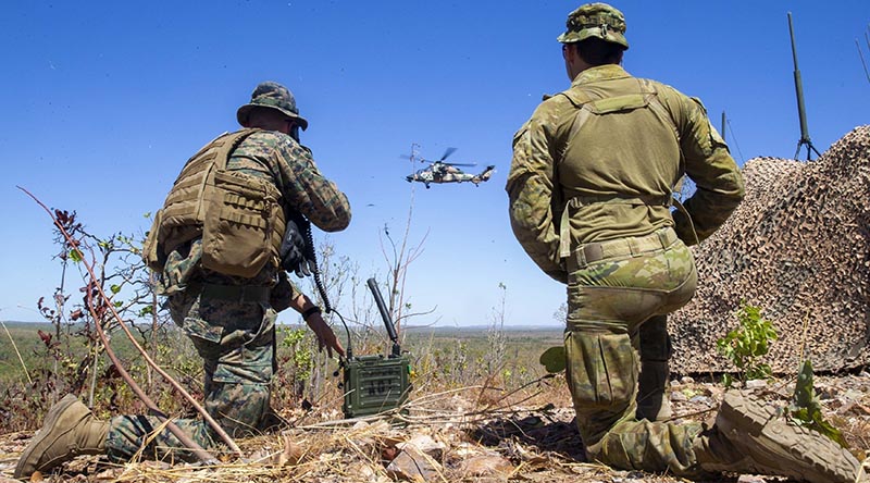 US Marine Corps Captain Benjamin Hovies and Australian Army Sergeant Aaron Costas manage airspace at Mount Bundey Training Area, during a US Air Force bombing mission. US Marine Corps photo by Corporal Harrison Rakhshani.