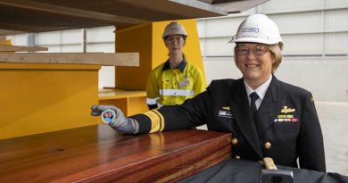 Head of Maritime Systems Rear Admiral Wendy Malcolm displays the Chief of Navy’s ceremonial coin about to be placed under the keel NUSHIP Pilbara at the Civmec facility in Henderson, Western Australia. Photo by Leading Seaman Ronnie Baltoft.