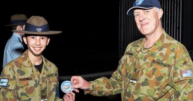 CCPL Jack Shadwick receives his first powered solo flight commemorative patch from the Executive Officer of No 704 Squadron, FLGOFF(AAFC) James Firkins, himself a qualified pilot and instructor.