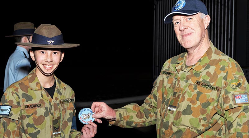 CCPL Jack Shadwick receives his first powered solo flight commemorative patch from the Executive Officer of No 704 Squadron, FLGOFF(AAFC) James Firkins, himself a qualified pilot and instructor.