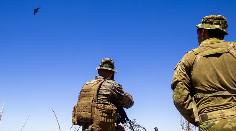 US Marine Corps Captain Benjamin Hovies and Australian Army Sergeant Aaron Costas direct the flight path of a US Air Force B-2 Spirit bomber at Mount Bundey Training Area, NT. A combined team of US Marines and Australian Defence Forces personnel provided target information to the US Air Force bombers conducting deep strikes on notional targets. US Marine Corps photo by Corporal Harrison Rakhshani.