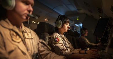 Surveillance and control officers man their terminals on a Royal Australian Air Force E-7A Wedgetail in the Middle East. Photo by Corporal Tristan kennedy.