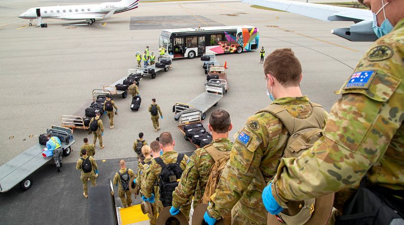 Soldiers from the 1st Battalion, Royal Australian Regiment, arrive at Perth Airport, Western Australia, to support quarantine compliance monitoring. Photo by Petty Officer Yuri Ramsey.