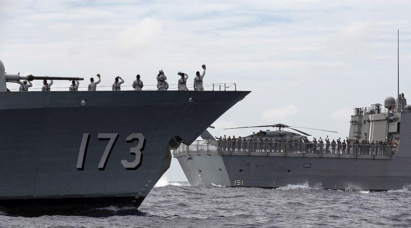 KD Perak, of the Royal Malaysian Navy, left, with HMAS Arunta during a passage exercise on the East Asia Deployment. Photo: Leading Seaman Jarrod Mulvihill