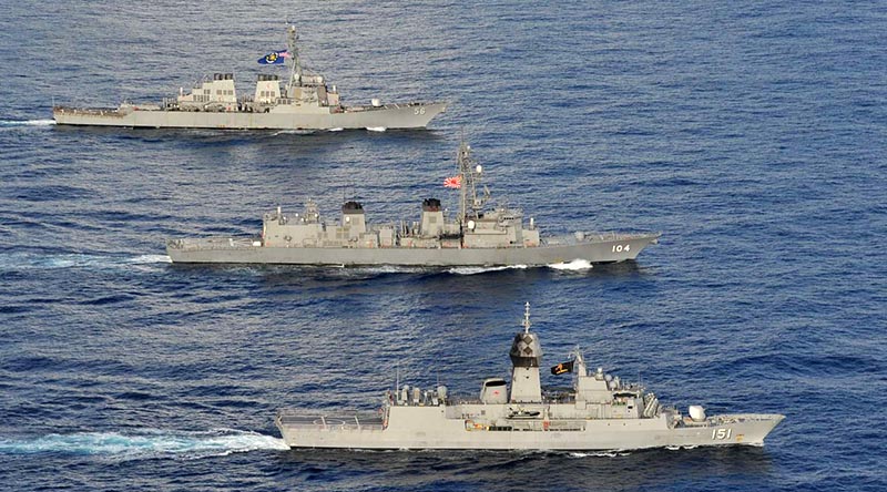 Arleigh Burke-class guided-missile destroyer USS John S. McCain, Japan Maritime Self-Defense Force JS Kirisame and HMAS Arunta in the South China Sea, 20 October 2020. Photographer unknown.