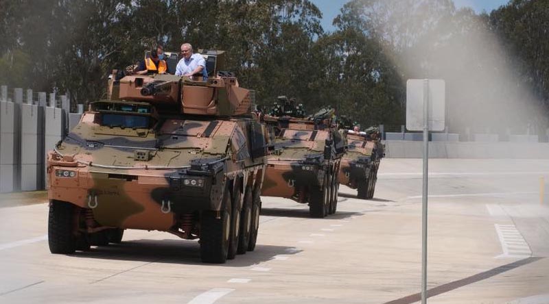 Prime Minister Scott Morrison in a Boxer combat reconnaissance vehicle at the Rheinmetall Military Vehicle Centre of Excellence (MILVEHCOE) in Ipswich, Queensland. Photo from the PM's Facebook page.